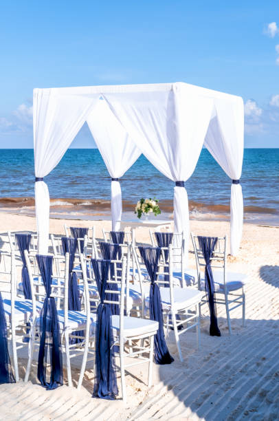 istock Blue themed wedding setup at the white sandy beach. Romantic getaway wedding 1213589403