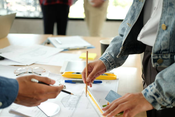 istock architect engineer team working discussing on house blueprint of real estate project in meeting 1213589918