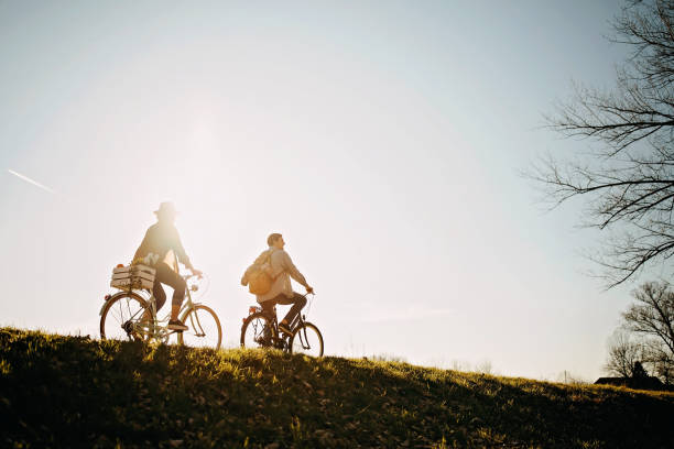 istock Couple relaxing on the sun with bicycle in nature 1213593806