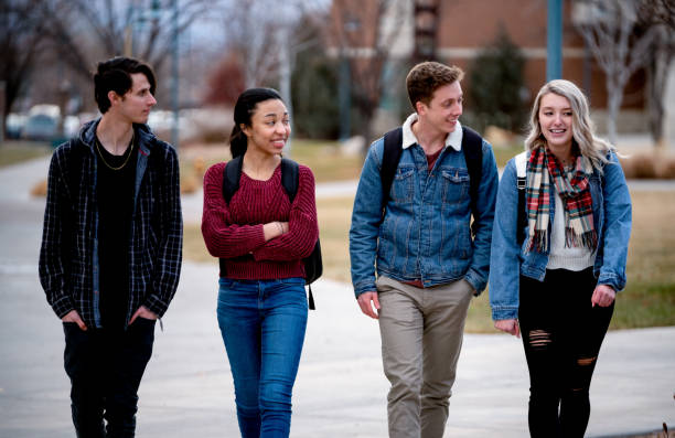 istock A Diverse Group Of College Students Talking As They Walk To Class 1213595774