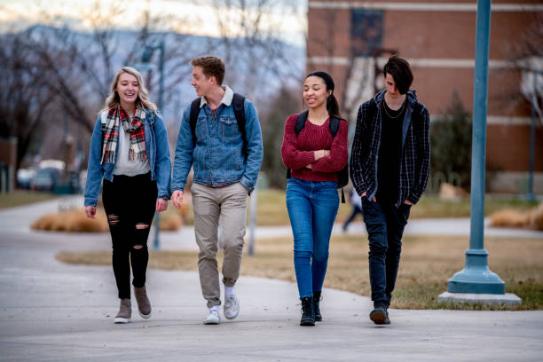 istock A Diverse Group Of College Students Talking As They Walk To Class 1213595822