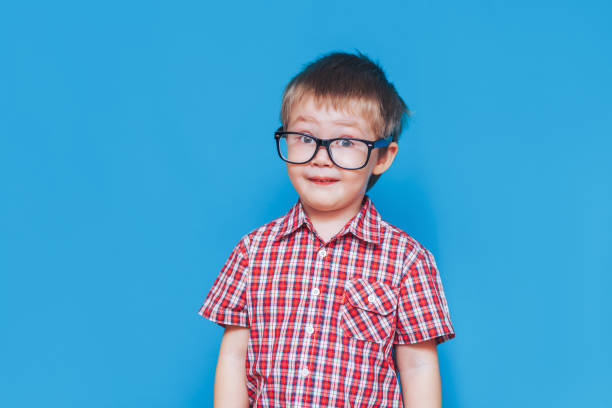istock Boy in red shirt show and glasses 1213600871
