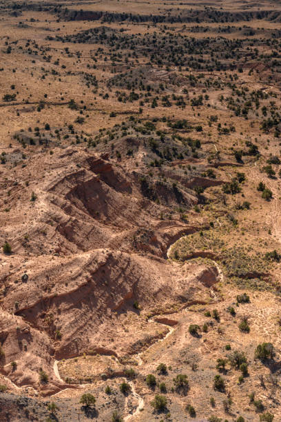 istock Dry Creek Bed Snakes Through Desert 1213600998