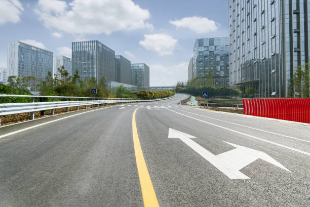 istock empty road with cityscape in modern city 1213601044