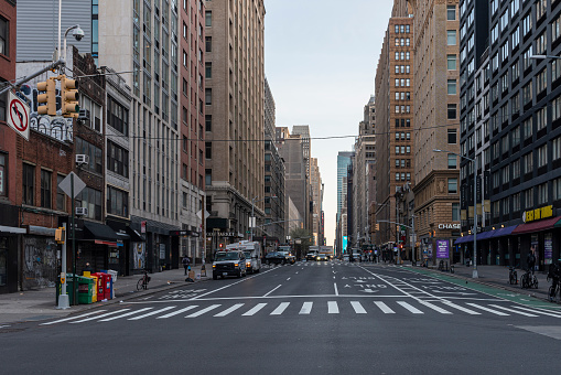 The lifeless deserted 23rd Street in Manhattan Flatiron District during the COVID-19 Coronavirus outbreak. Manhattan, New York City, USA.