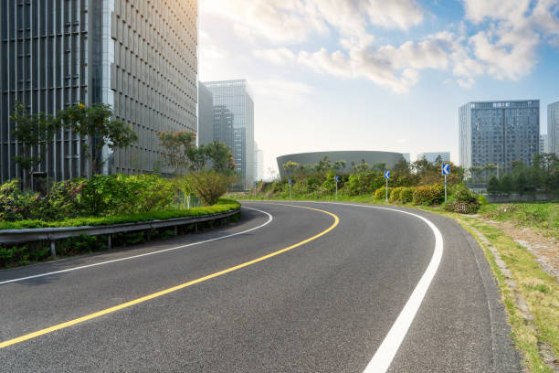 istock empty road with cityscape in modern city 1213601755