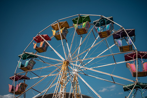 Ferris wheel at the street fair with blue sky background at sunset in the state of Hidalgo