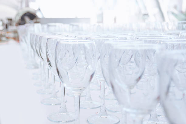 empty glass glasses on the table in the restaurant . festive reception