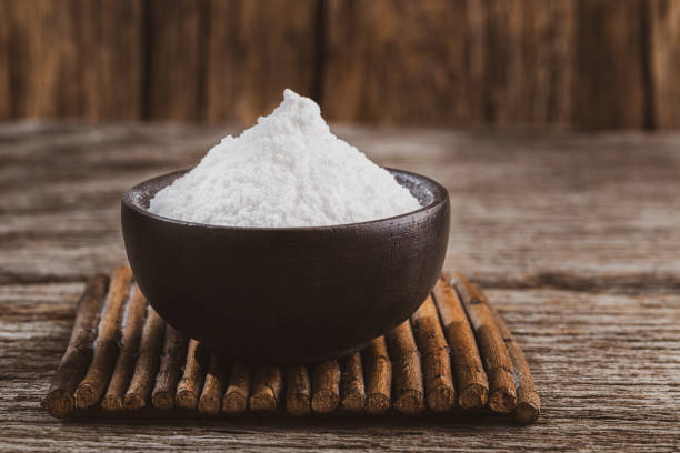 istock Baking soda on wooden background 1213609676