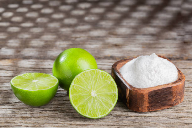 istock Baking soda and lemon on wooden background space for text 1213609803