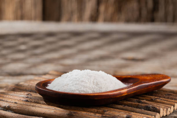 istock Baking soda on wooden background 1213609893