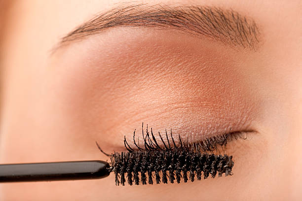 istock Close-up female applying mascara 121361060