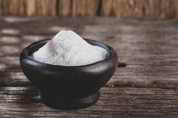 istock Baking soda on wooden background 1213610659