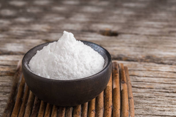 istock Baking soda on wooden background 1213611484