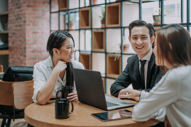 istock a group of young asian chinese executive having discussion meeting in office co-sharing work place with laptop 1213614931