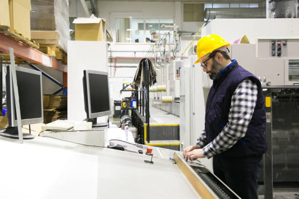 istock Focused male engineer in glasses operating machine 1213615057