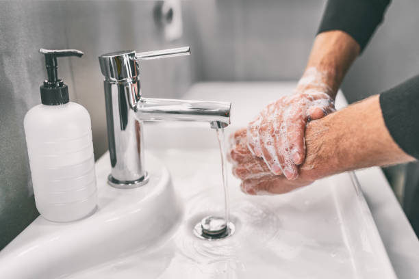 washing hands rubbing with soap man for corona virus prevention, hygiene to stop spreading coronavirus - only young men imagens e fotografias de stock
