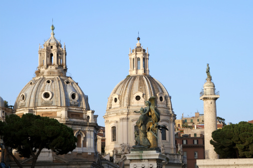 View of buildings of Rome. Domes and sctatues. Rome, Italy