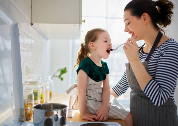 istock family are preparing bakery together 1213621573