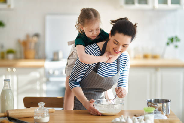 istock family are preparing bakery together 1213621579