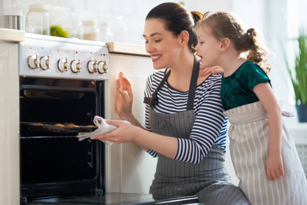 istock family are preparing bakery together 1213621583