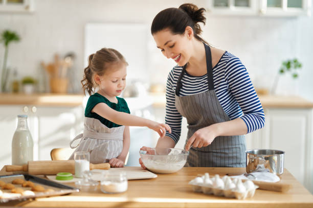 istock family are preparing bakery together 1213621587