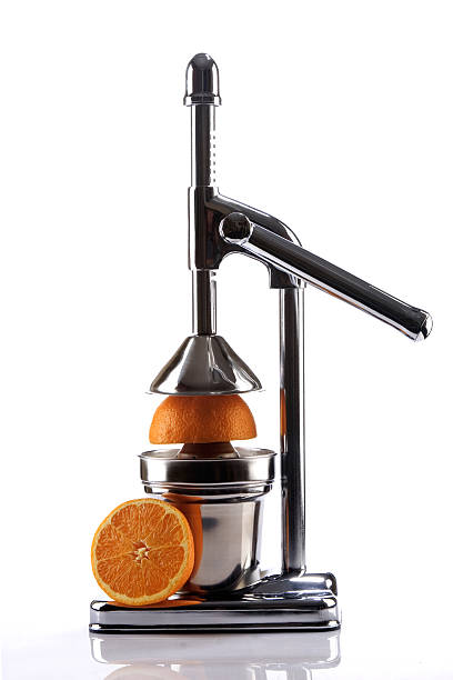 istock Chrome Citrus Juicer and Orange Halves 121362203