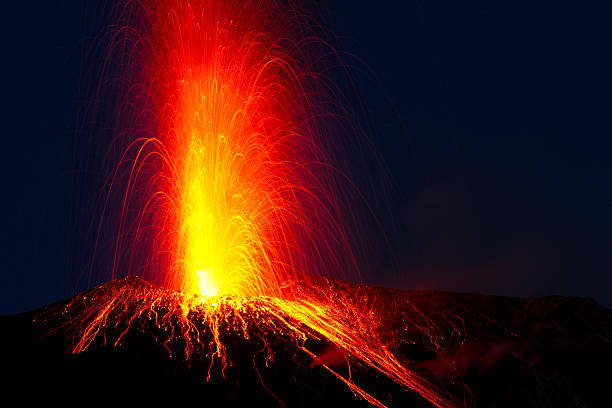 Close-up of red lava spewing from Stromboli volcano erupting stock photo