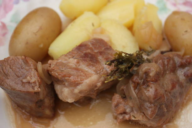 istock Veal with onions served with boiled potatoes 1213623482