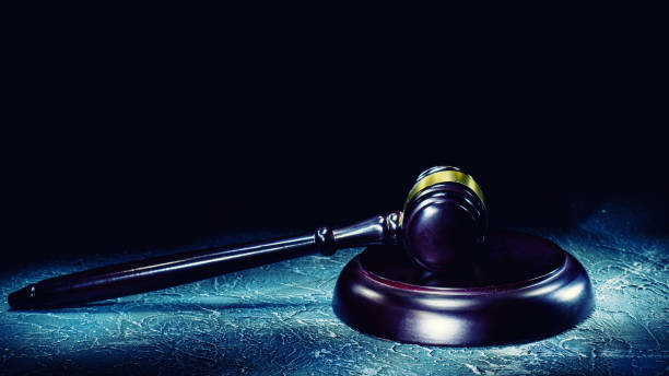 istock Judge's gavel lies on a stone table. 1213623508