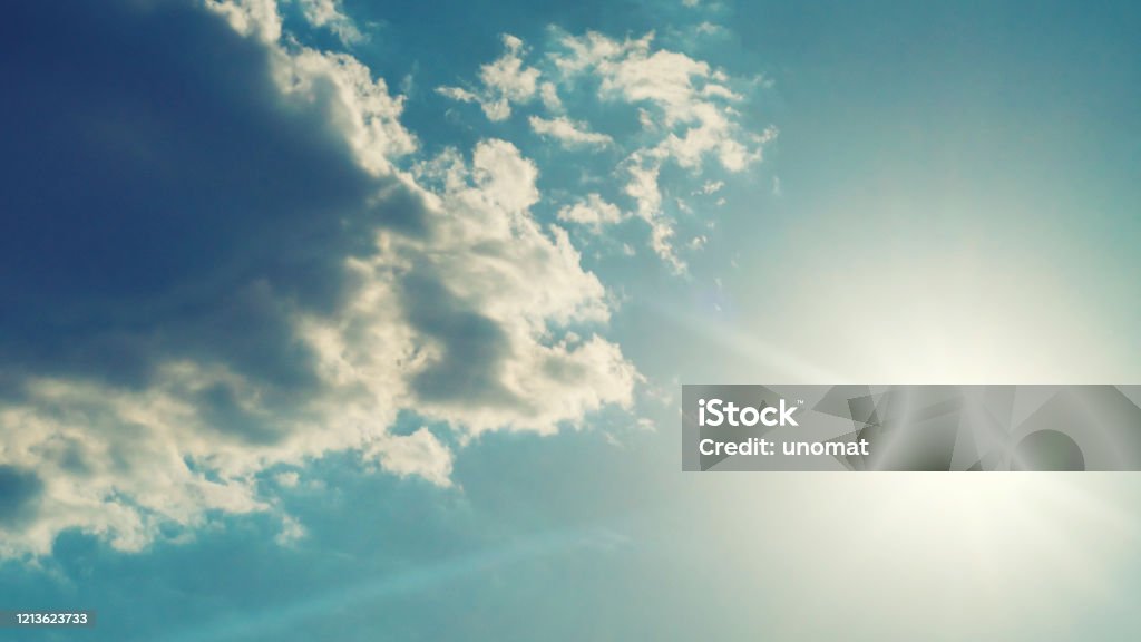 The sun shines bright in summer. Blue sky and clouds. The sun shines bright in summer. Blue sky and clouds.- image toned Hope - Concept Stock Photo