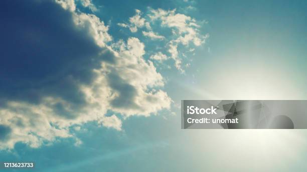 The Sun Shines Bright In Summer Blue Sky And Clouds Stock Photo - Download Image Now
