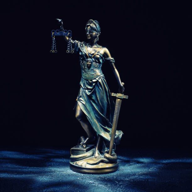 istock Themis statuette stands on the old vintage stone table. 1213623847