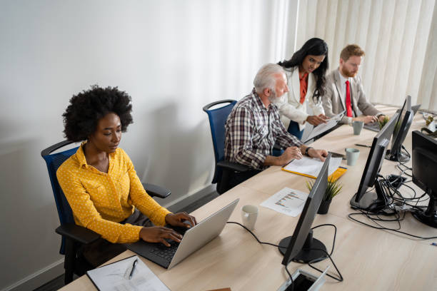 istock Supervisor observes work of employees 1213624790