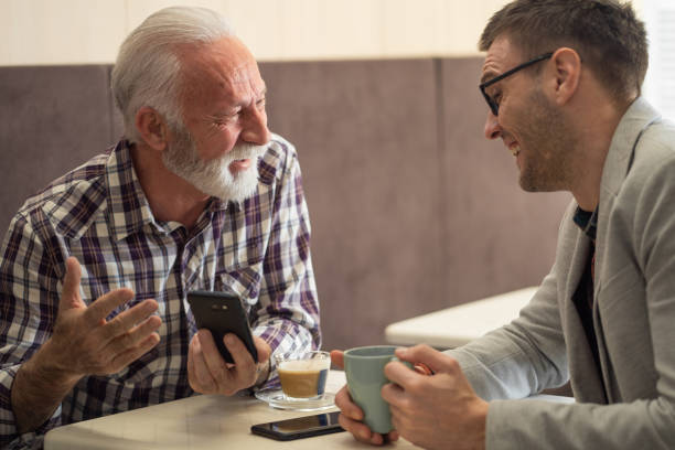 istock Senior director and his assistant on a coffee break 1213625747