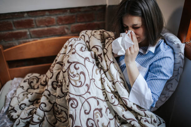 istock Infected woman at home 1213626839