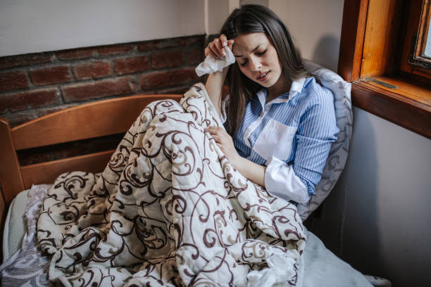 istock Sick woman at home 1213627187