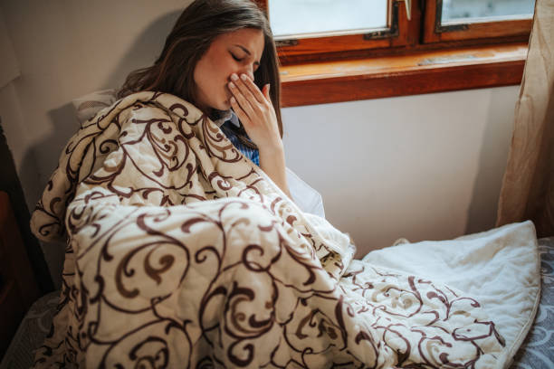 istock Sick woman at home 1213627974
