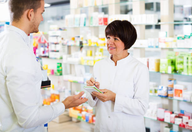 istock Woman druggist wearing white coat 1213629211