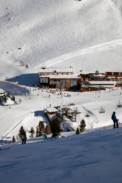 Panoramic view of the ski resort Ischgl with skiers and snowborders on the slopes. stock photo