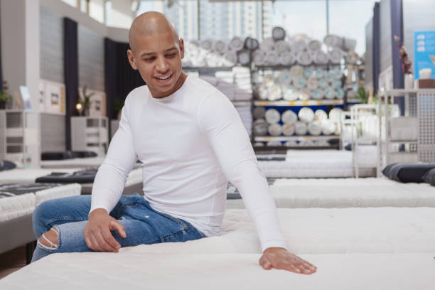 istock Hansome young African man shoppingat home goods store 1213635049