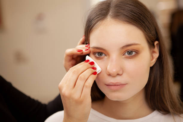 istock Beautiful woman getting professional makeup done 1213636121