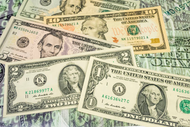 close up US dollar banknotes on background.