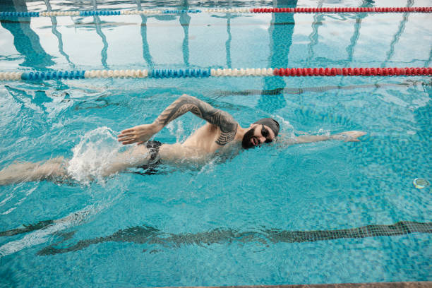 istock Sporty athlete swimming in pool 1213638181