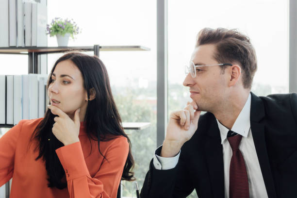 istock Two business people discussing about work in an office. 1213638200