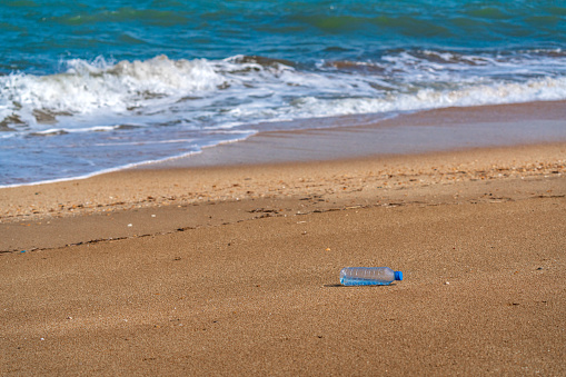 Plastic water bottle on the beach