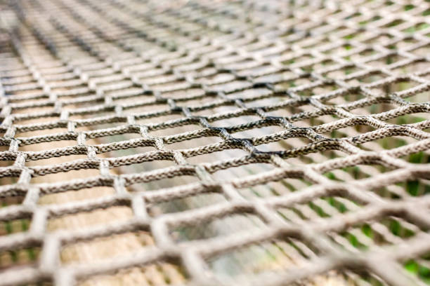 istock Braided rope protective mesh for safety in the park. 1213639423
