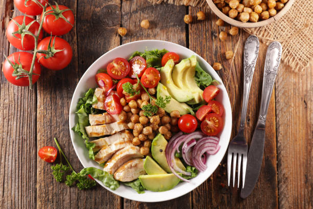 istock vegetable salad with chicken, chickpea, avocado,tomato and onion 1213639533
