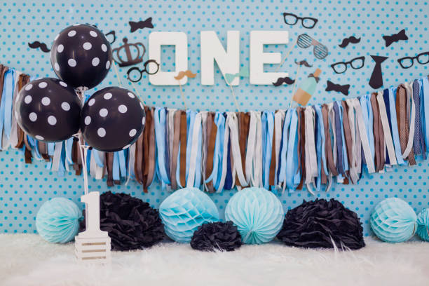 istock Little Man Party Background with number One Text 1213640652