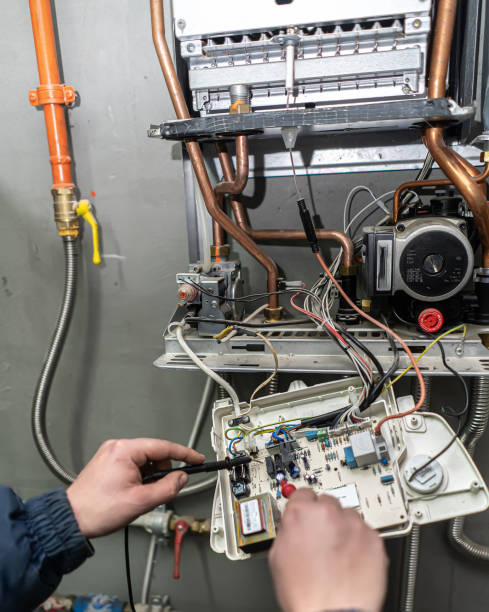istock the master repairs the wall mounted gas boiler 1213642497